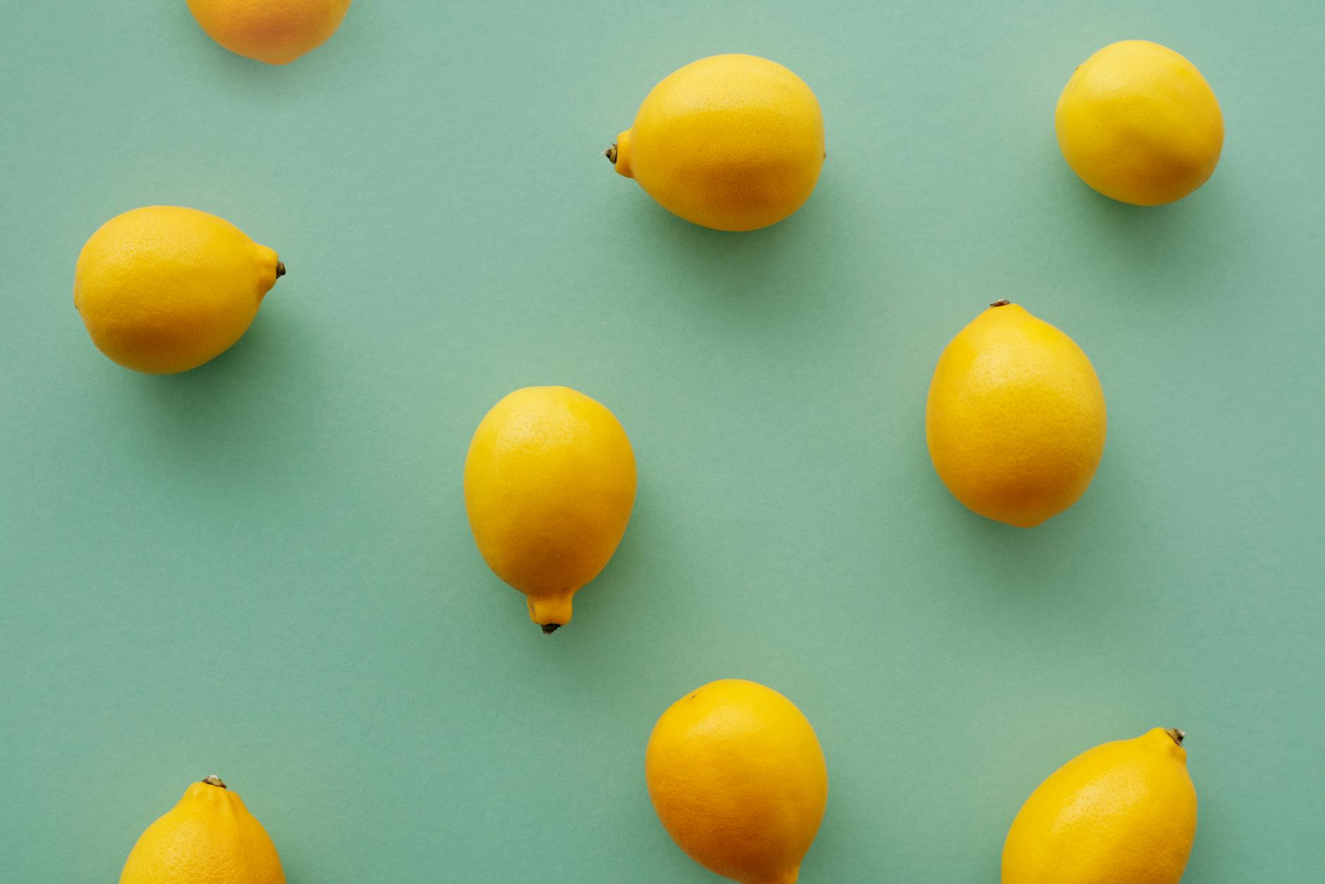 A yellow silicone vibrator surrounded by peeled bananas on a yellow background, symbolizing pleasure and ease