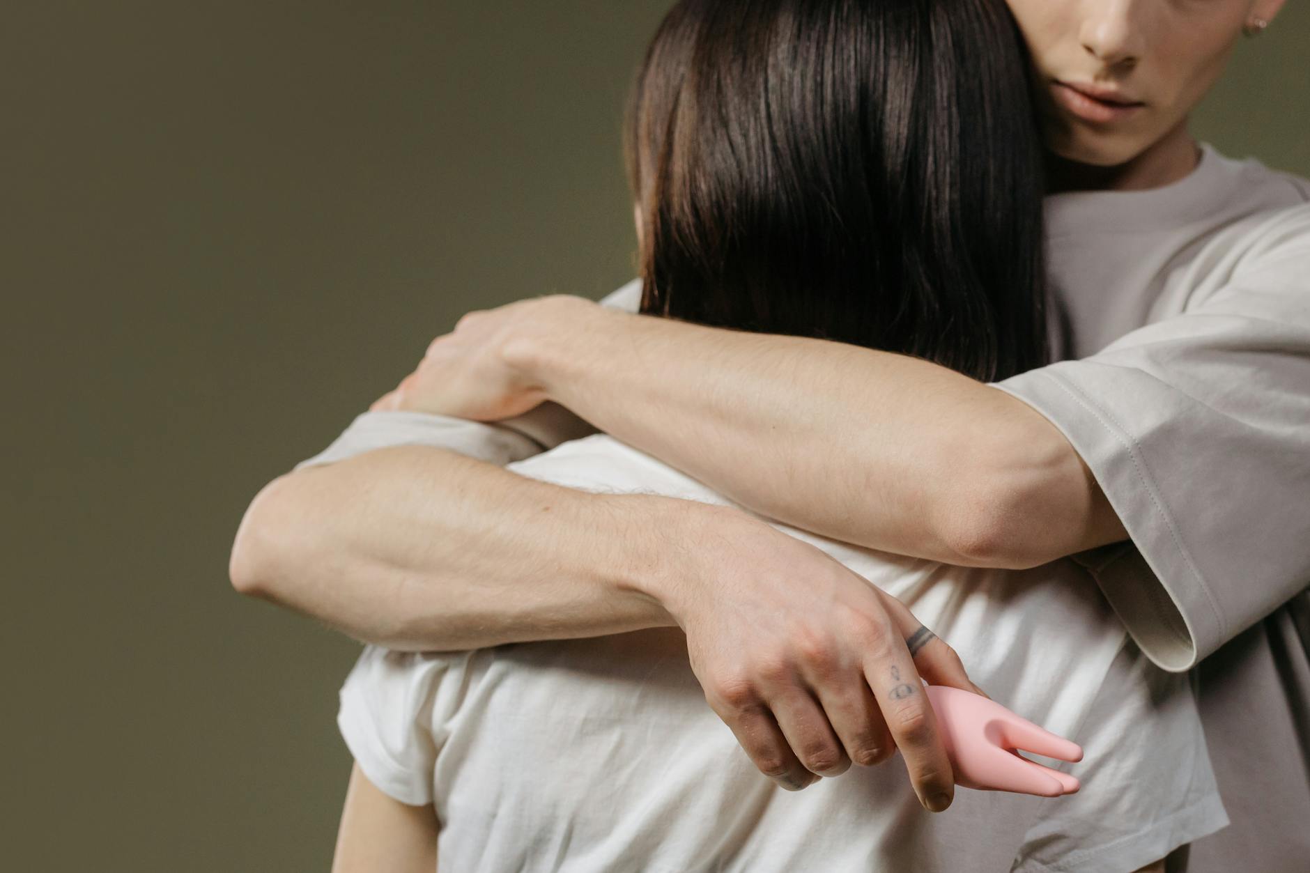 Close-up of a couple embracing, highlighting emotional connection and intimacy.